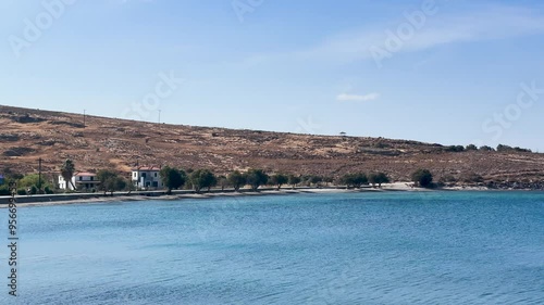 sailing boat anchored in the bay of sigri town of lesbos island greece clouds and islands photo