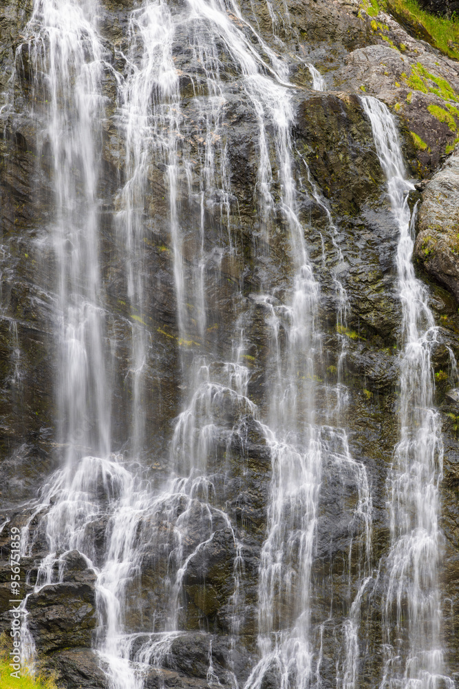 Vertical close-up of the Brekkefossen waterfall in Flåm, Norway Vertical close-up of the Brekkefossen waterfall in Flåm, Norway
