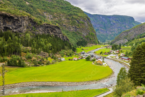 View of the southern part of the village of Flåm, valley and Flåmselvi river from the Flam railway (Flåmsbana), Norway