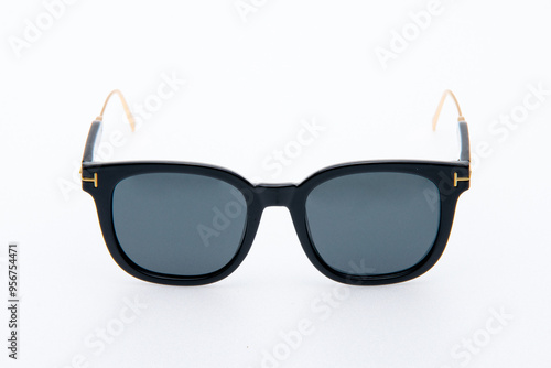 Fashion sunglasses black frames on the white background. photo