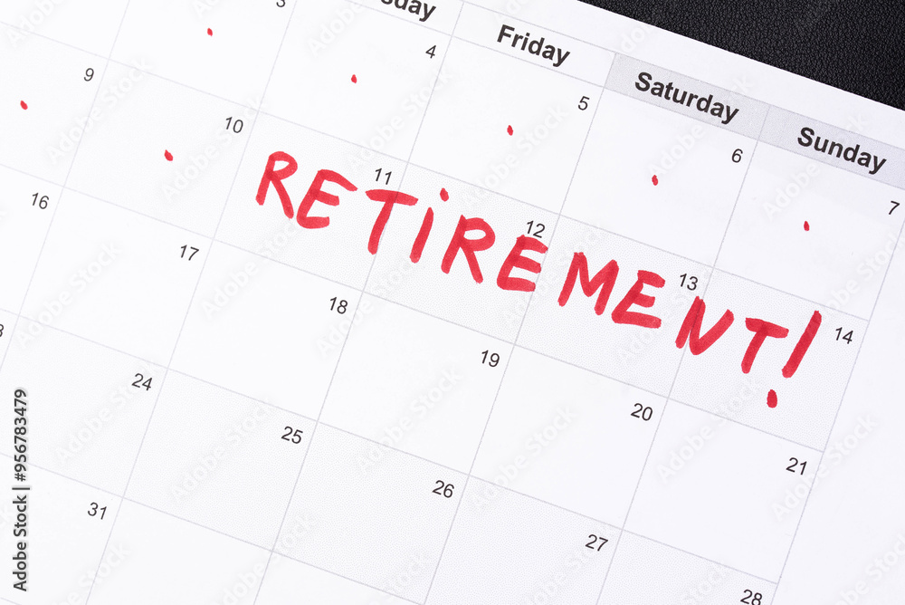 Hand fills in a large wall calendar, counting down the days until retirement, writing 'Retirement'. Concept of early retirement, the Financial Independence, Retire Early movement (FIRE) Hand fills in a large wall calendar, counting down the days until retirement, writing 'Retirement'. Concept of early retirement, the Financial Independence, Retire Early movement (FIRE)
