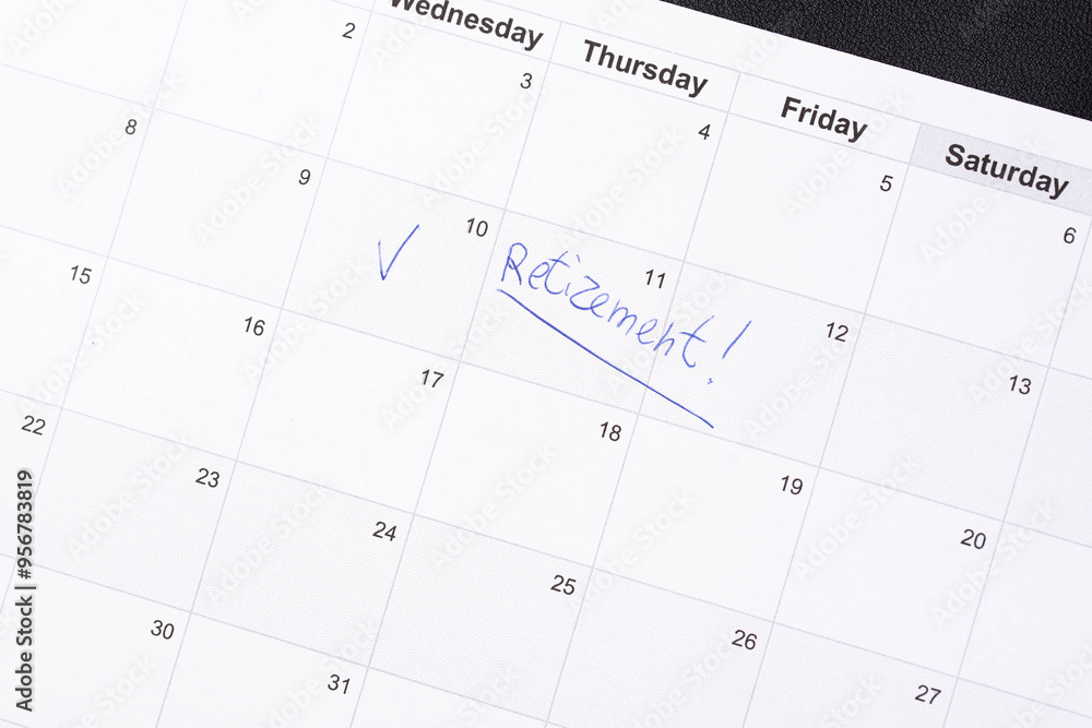 Hand fills in a large wall calendar, counting down the days until retirement, writing 'Retirement'. Concept of early retirement, the Financial Independence, Retire Early movement (FIRE) Hand fills in a large wall calendar, counting down the days until retirement, writing 'Retirement'. Concept of early retirement, the Financial Independence, Retire Early movement (FIRE)