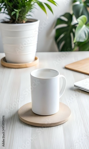 A simple and elegant white mug on a wooden coaster on a light wood table.