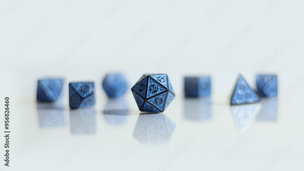A blue D20 polyhedral die with other dice on the background taken with shallow depth of field A blue D20 polyhedral die with other dice on the background taken with shallow depth of field
