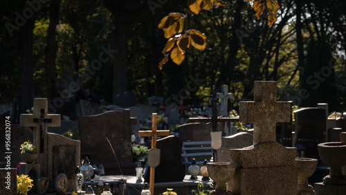 
CEMETERY - Tombstones and crosses in autumn time photo