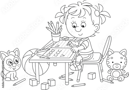 Smiling little girl writing in a copybook at her desk among funny toys in a nursery room, black and white outlined vector cartoon illustration for a coloring book page