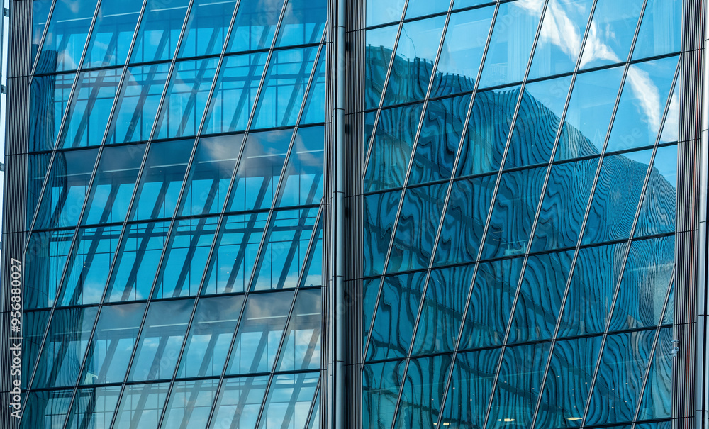 Obraz premium modern architectural background, glass and metal facade of contemporary building