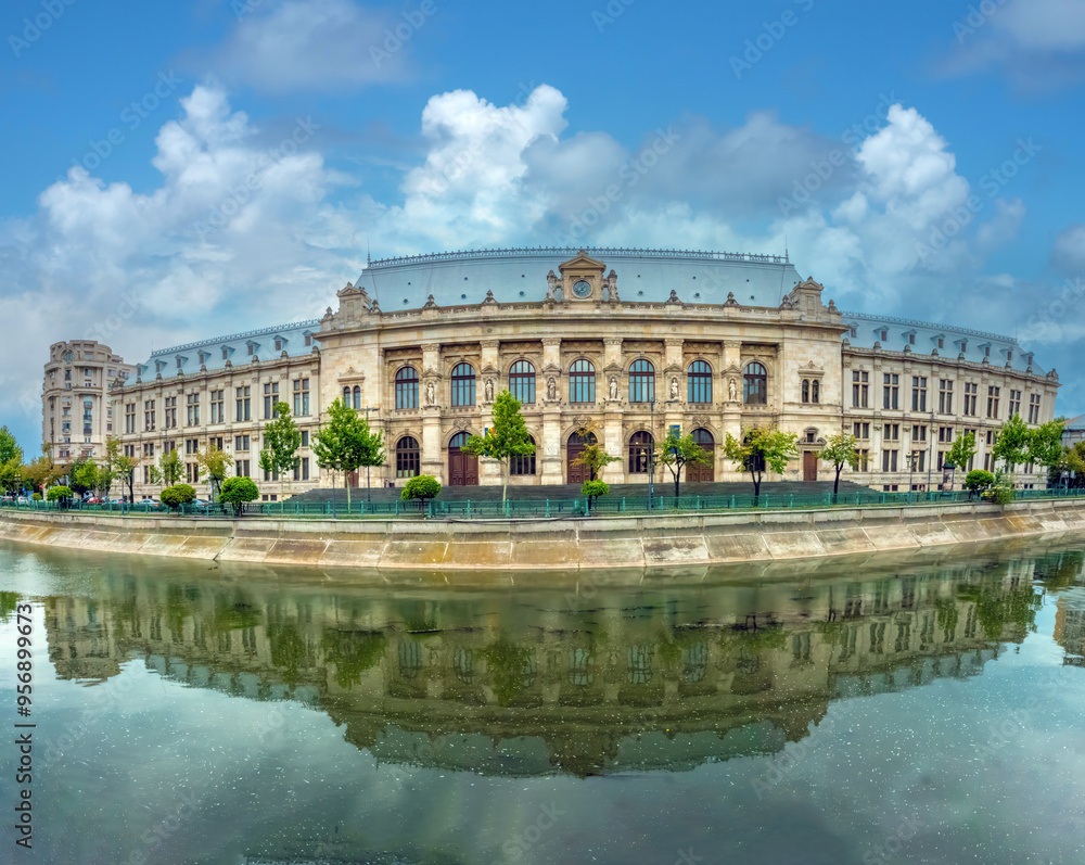 The Dâmbovița river flowing through Bucharest, flanked by the imposing architecture of the Romanian The Dâmbovița river flowing through Bucharest, flanked by the imposing architecture of the Romanian