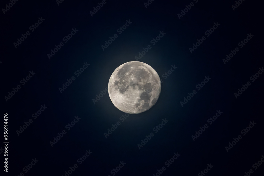 The near side of the moon at night as seen from earth with a dark background The near side of the moon at night as seen from earth with a dark background