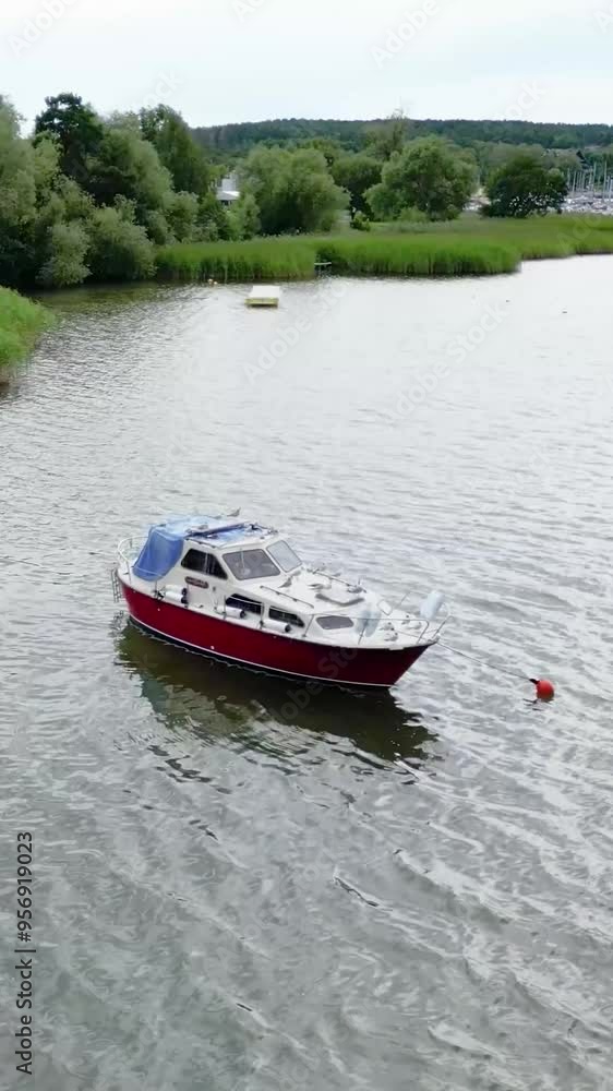 boat vessel pleasure craft parked docked anchored in lake water waves blue lakeside coast aerial forward flying towards drone boat vessel pleasure craft parked docked anchored in lake water waves blue lakeside coast aerial forward flying towards drone