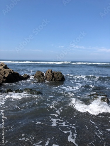 waves crashing on rocks on the coastlin