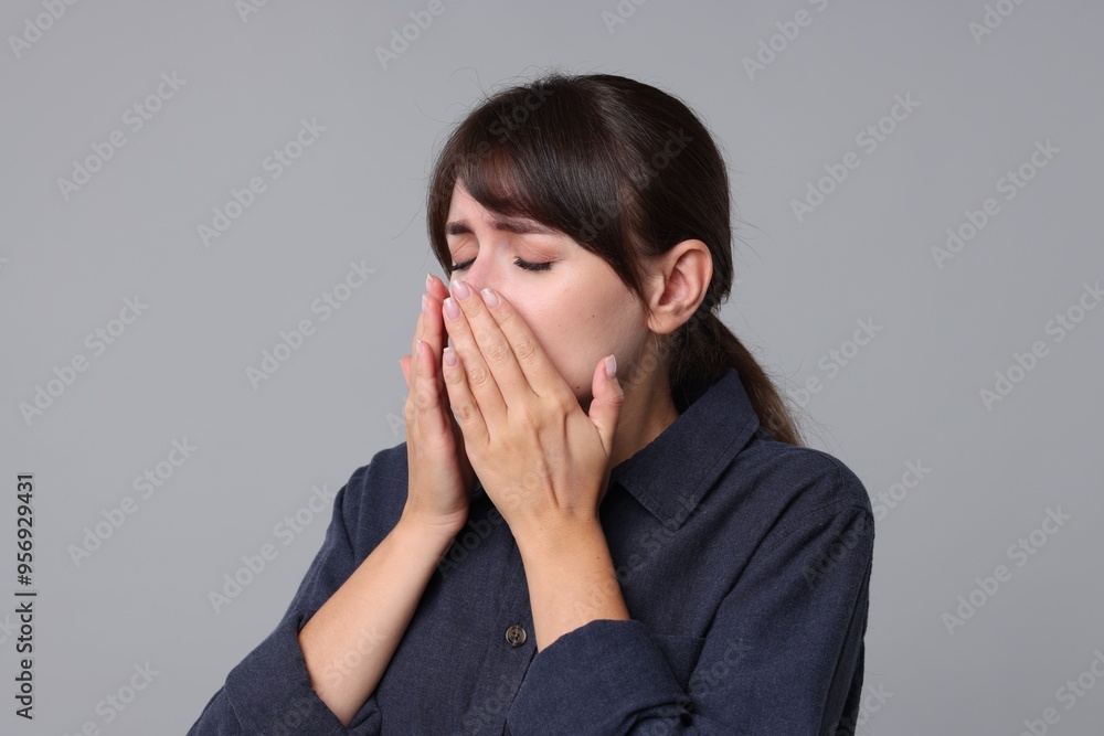 Woman suffering from sinusitis on grey background Woman suffering from sinusitis on grey background