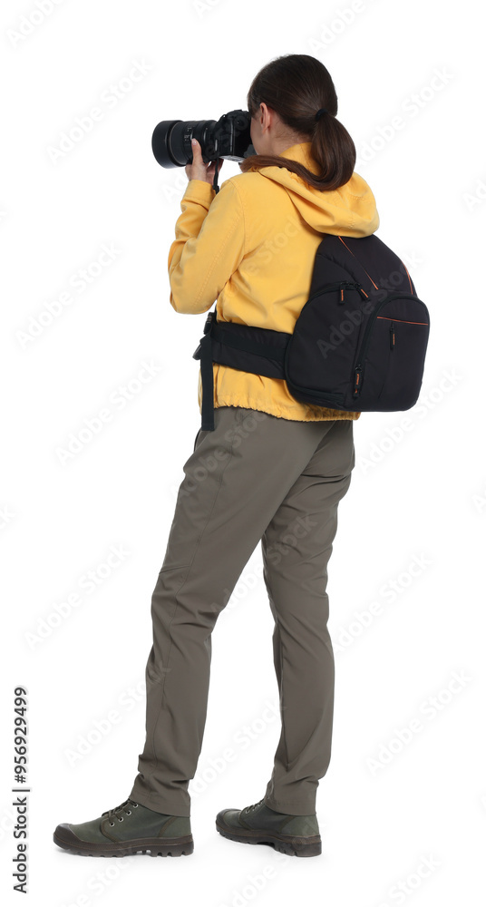 Photographer with backpack and camera taking picture on white background Photographer with backpack and camera taking picture on white background