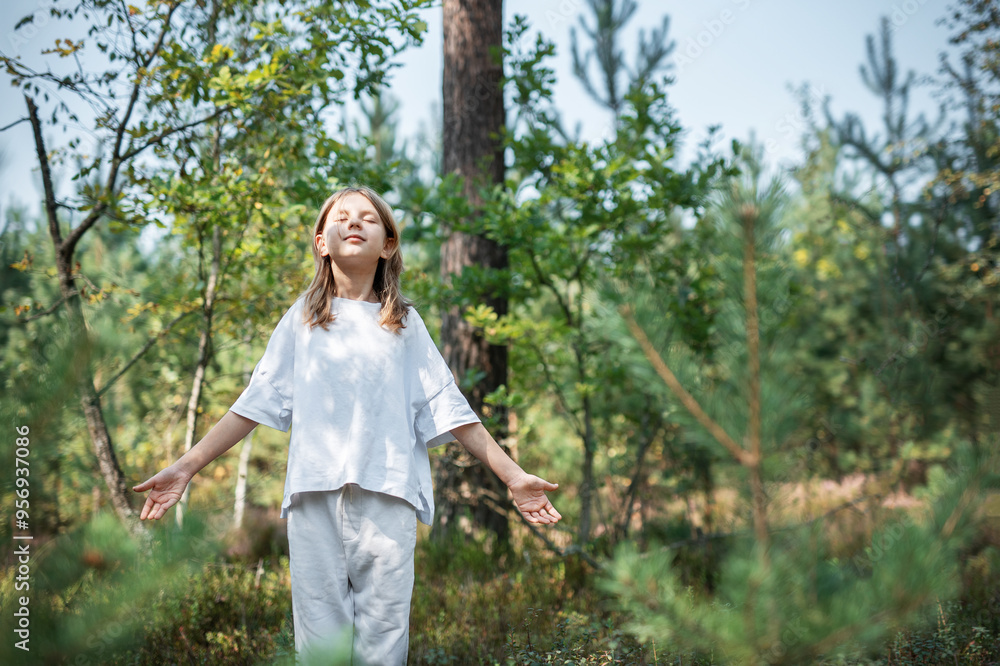 A teenage girl who breathes fresh air and relieves stress in the forest. A teenage girl who breathes fresh air and relieves stress in the forest.