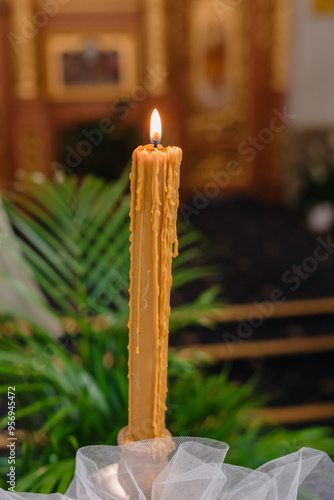 burning candle in a candlestick