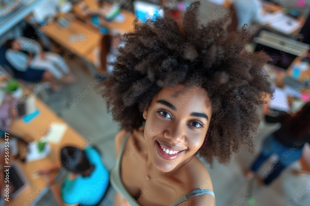 Confident young mixed race businesswoman with curly hair smiling and standing with arms crossed in an office setting Confident young mixed race businesswoman with curly hair smiling and standing with arms crossed in an office setting