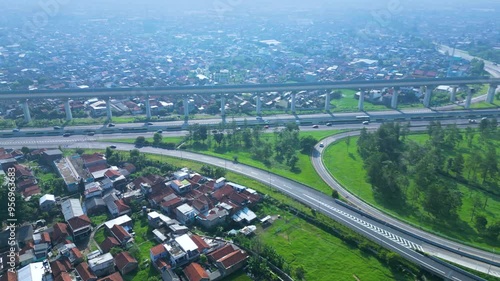 Established Aerial View of Pasir Koja Interchange, the meeting point of Soroja Toll Road, Purbaleunyi Toll Road and Jakarta-Bandung High Speed ​​Rail Line, Bandung, Indonesia photo