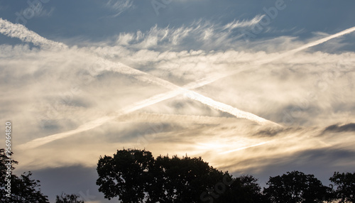 Serene Sky with Contrails at Sunset
