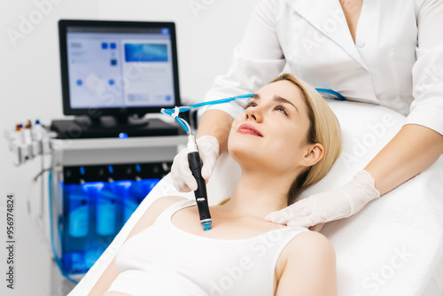 A professional esthetician performs RF lifting and vacuum facial massage to tighten and rejuvenate the skin, promoting a youthful appearance. Ideal for showcasing advanced skincare treatments.