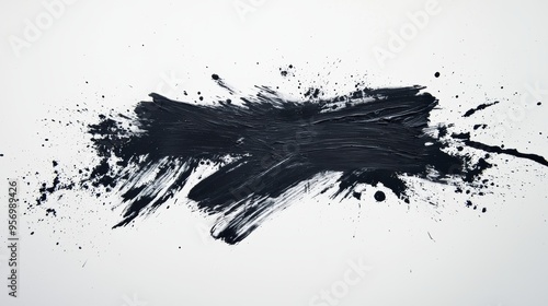 Grunge brushstroke with textured splatter effect.