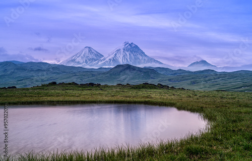 View to Klyuchevskaya Sopka and Bezymyanny volcano in Kamchatka Peninsula in Russia.
