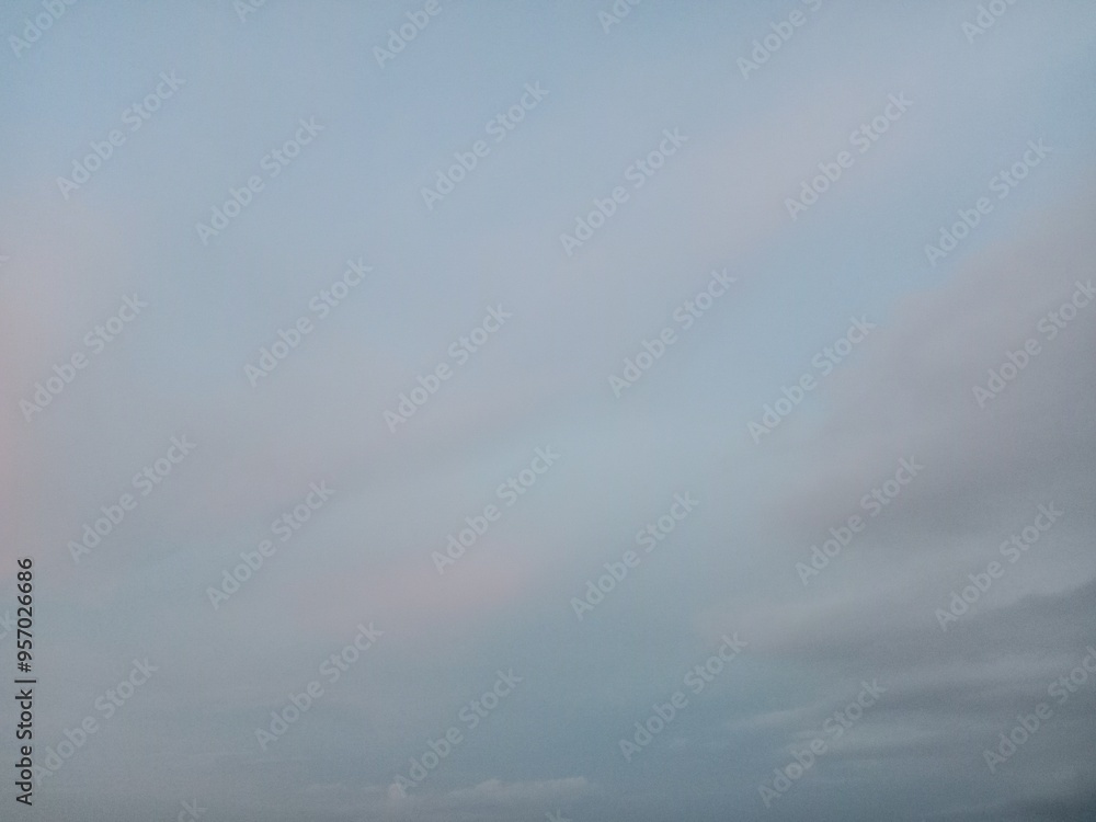 A clear blue sky with a few clouds. The sky is so clear that it almost looks like a painting A clear blue sky with a few clouds. The sky is so clear that it almost looks like a painting