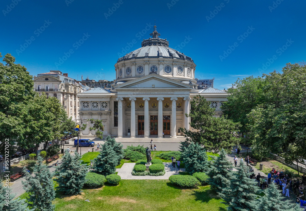 Obraz premium Romanian Atheneum in Bucharest. Aerial view of this amazing landmark historical building from Bucharest, Romania, on Victoriei Avenue (Calea Victoriei). Travel to Romania.