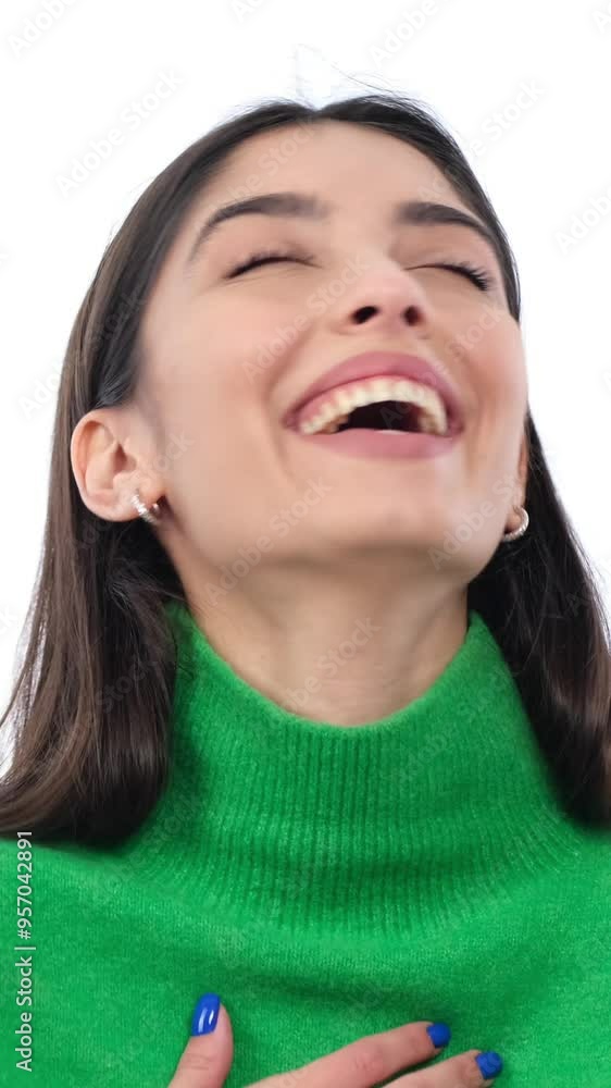 Portrait of a happy and friendly young adult Caucasian woman laughing on white background. Concept of a positive emotions. Vertical video. Portrait of a happy and friendly young adult Caucasian woman laughing on white background. Concept of a positive emotions. Vertical video.