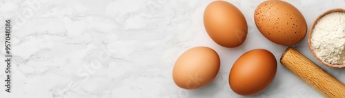 Ultra-realistic shot of farm-fresh eggs, whole wheat flour, and a rolling pin on a marble countertop, showcasing quality ingredients for artisanal food branding and advertising photo