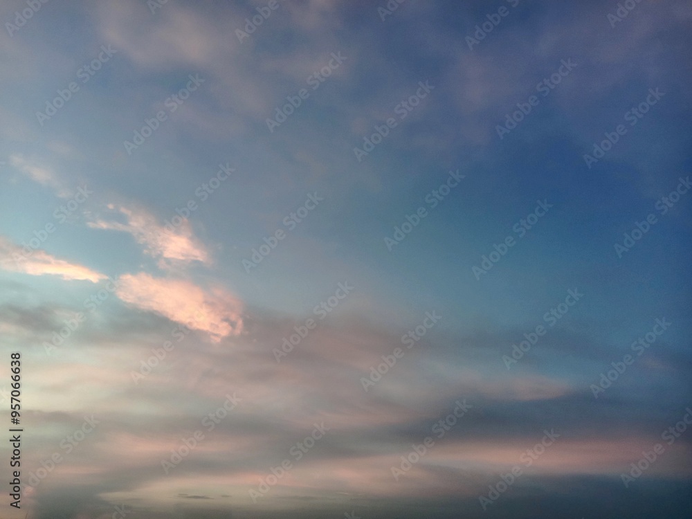 A clear blue sky with a few clouds. The sky is so clear that it almost looks like a painting A clear blue sky with a few clouds. The sky is so clear that it almost looks like a painting