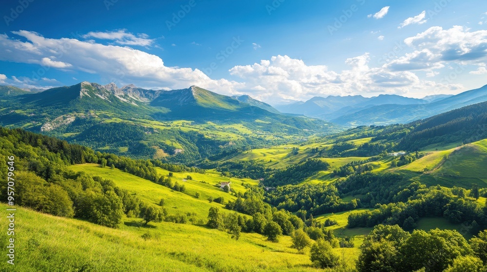 Naklejka premium Serene Mountain Landscape: A Picturesque View of Lush Green Valleys and Forests under Clear Blue Skies