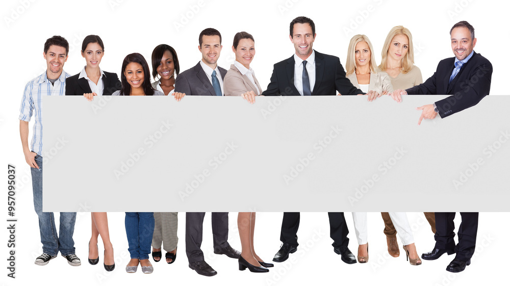Diverse group of executives holding a blank banner Diverse group of executives holding a blank banner