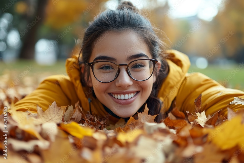 Beautiful woman having fun in an autumn park at sunset collecting fallen yellow leaves. Concept of vacation, weekend, fun. Beautiful woman having fun in an autumn park at sunset collecting fallen yellow leaves. Concept of vacation, weekend, fun.