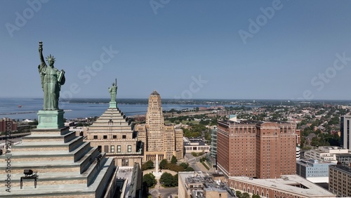 Downtown Buffalo, NY with Buffalo City Hall, office towers in morning sunshine traffic on streets below Liberty Building Art deco architecture