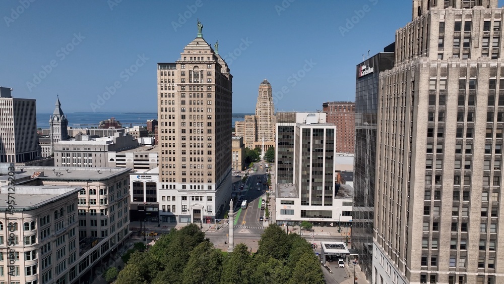 Downtown Buffalo, NY with Buffalo City Hall, office towers in morning sunshine traffic on streets below Liberty Building Art deco architecture Downtown Buffalo, NY with Buffalo City Hall, office towers in morning sunshine traffic on streets below Liberty Building Art deco architecture