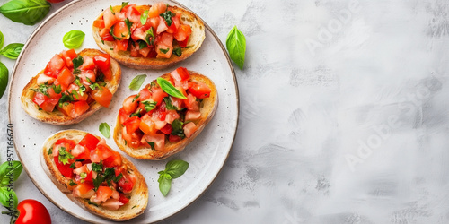 Tomato bruschetta on a long plate with garnishes beside each piece