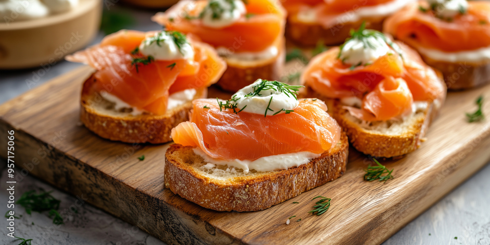 Close-up of smoked salmon crostini on a wooden board with toppings Close-up of smoked salmon crostini on a wooden board with toppings