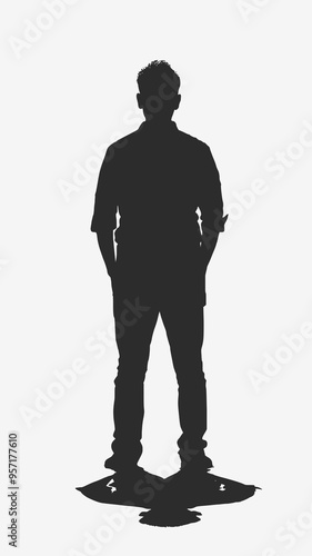 Silhouette of a man standing with hands in pockets