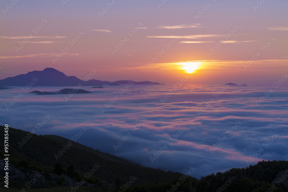 Fototapeta premium Sunset on the route of the swallows. Sunset in the Pyrenees from the Jeandel refuge, France.