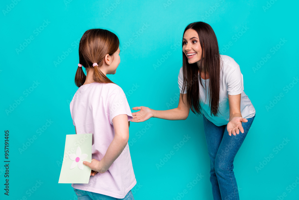 Photo of cute lovely girl greeting mommy mother day celebration isolated on cyan color background Photo of cute lovely girl greeting mommy mother day celebration isolated on cyan color background
