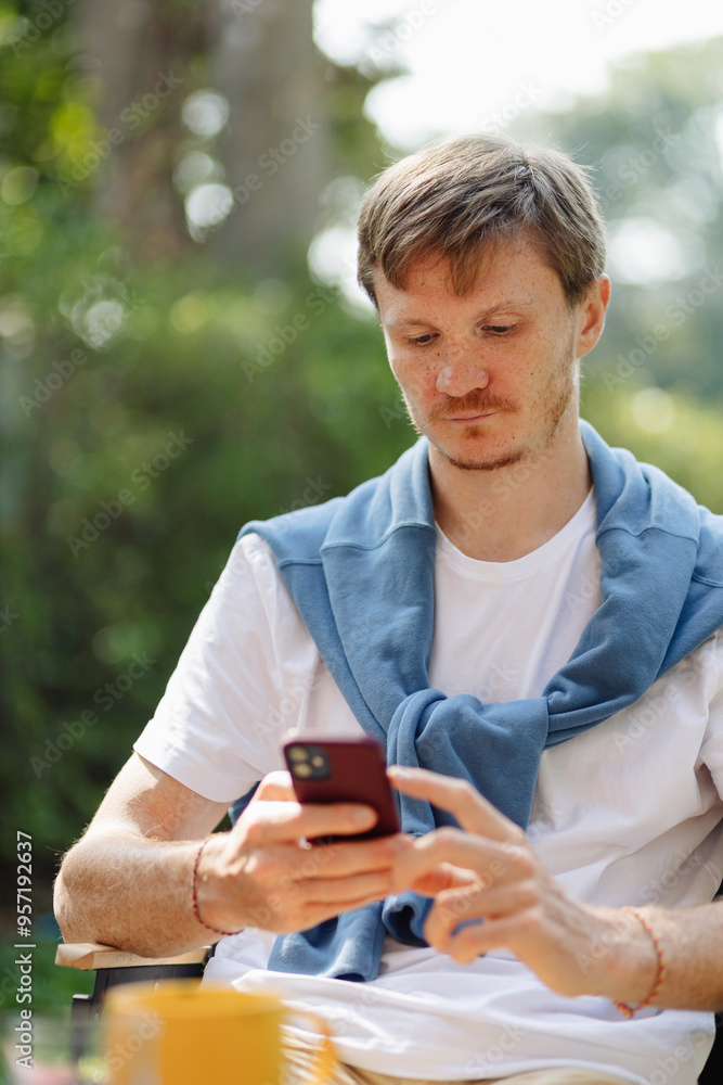 Man browsing smartphone Man browsing smartphone