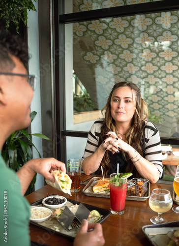 Friends Dining At Restaurant 