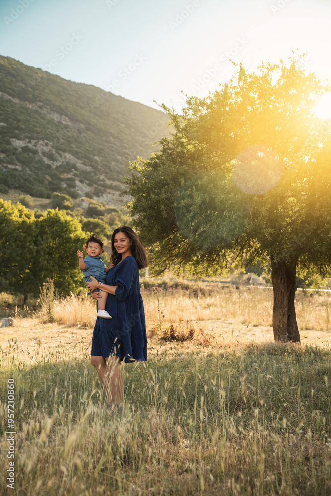 Mother Holding Her One Year Old Son in Nature Mother Holding Her One Year Old Son in Nature
