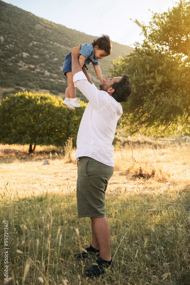 Father and Son Enjoying Playtime in Nature Father and Son Enjoying Playtime in Nature