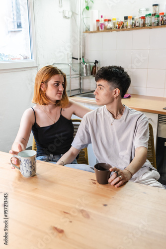 LGBTQ couple alking in the kitchen photo