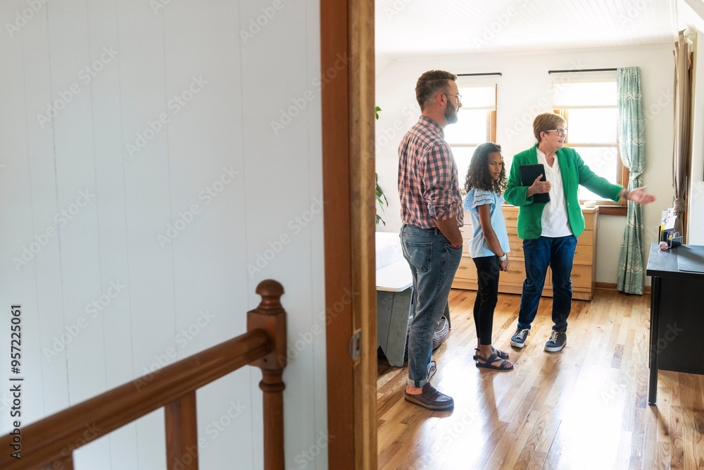 Real Estate Agent Showing Bedroom to Family Real Estate Agent Showing Bedroom to Family