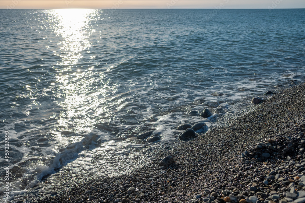 Seashore, small stones, sea wave. Marine background. Seashore, small stones, sea wave. Marine background.