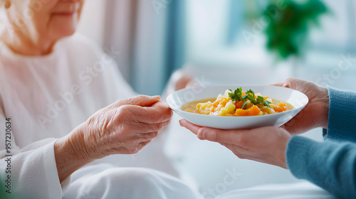 A patient recovering from a major surgery rests in a hospital bed as their partner feeds them homemade soup brought from home. The tender care and nourishment symbolize the deep connection and support photo