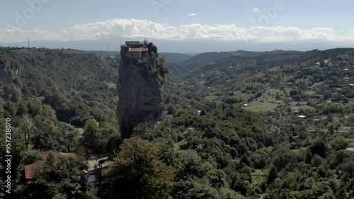 Experience a breathtaking aerial journey around theKatskhi Pillar in Georgia, captured in stunning 4K drone footage. This iconic limestone monolith rises majestically from the landscape