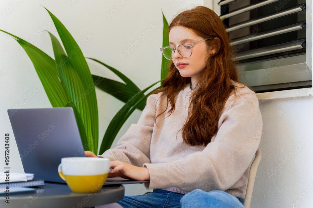 Girl Studying with Papers and laptop Girl Studying with Papers and laptop